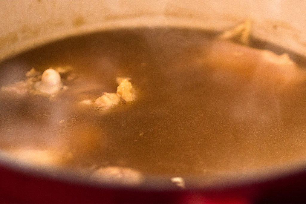 simmering chicken in broth