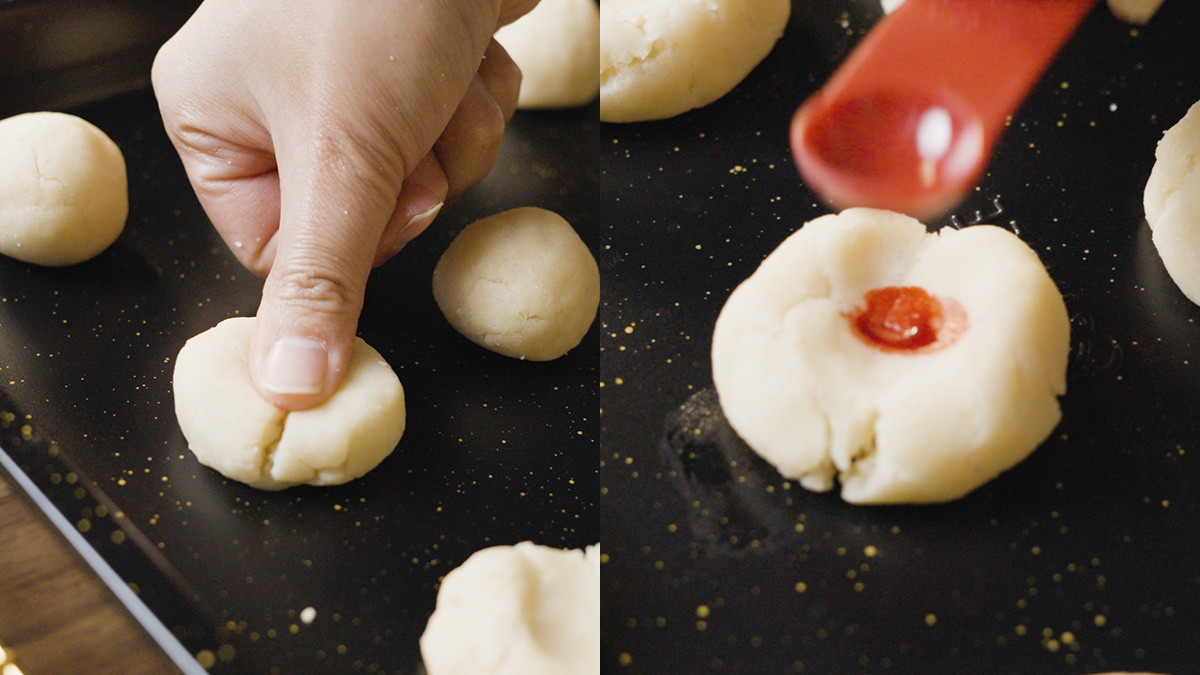 Thumb pressing an indent into a cookie dough ball on a baking sheet. Split image showing a thumb making an indent in cookie dough and a red dot being stamped into the center.