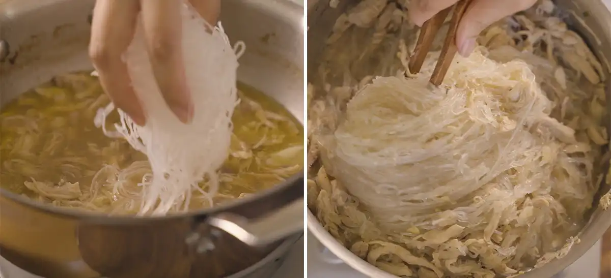 Soaked bean thread noodles being lowered into the pot of broth and shredded chicken, then the noodles being stirred into the mixture with wooden chopsticks