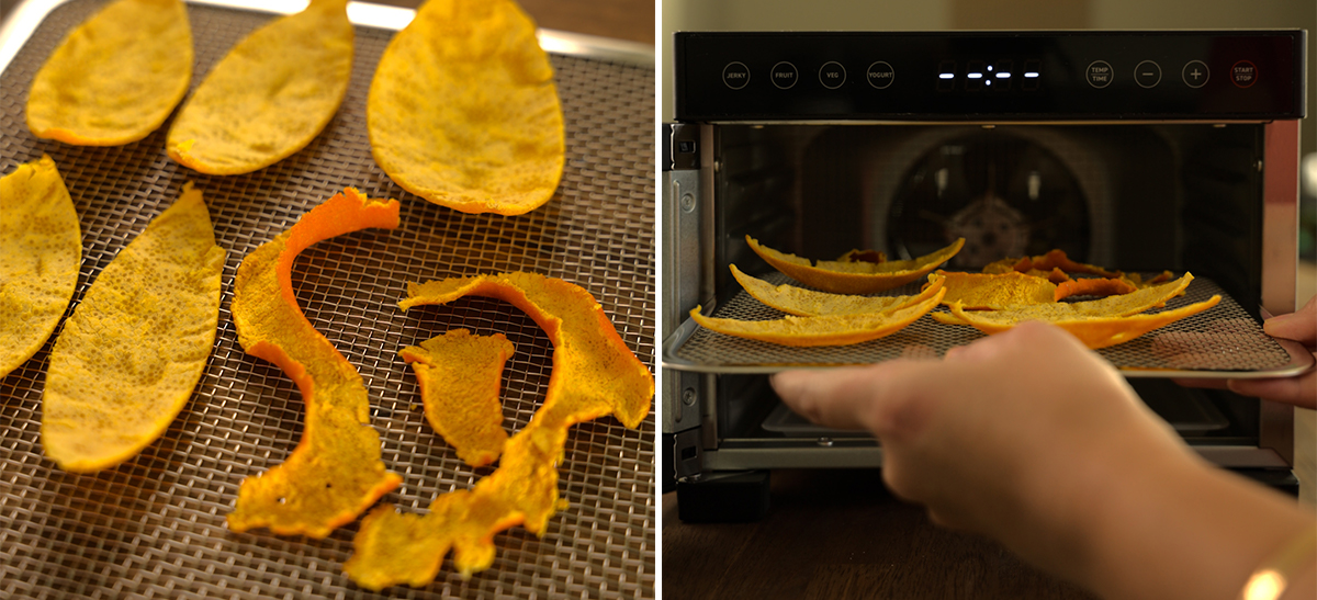 Left: Large flat pieces and smaller curled strips of orange peel laid out on a mesh dehydrator tray, ranging from pale yellow to deep orange. Right: Hand sliding a mesh tray loaded with orange peel strips into a food dehydrator.